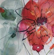 Deep red dahlia with pen against a pale green background.