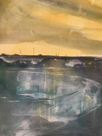 Yellow sky above blue marshes and sea