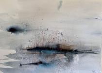 Abstract of lake with small islands in early morning mist.