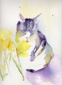 Billy the tabby cat smelling daffodils