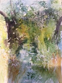 Sparkling sunlight on summer trees and water