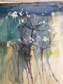 Blue Green fen with hogweed in the foreground. Atmospheric mood