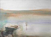 Solitary boat moored in mud flats of Norfolk