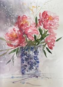 Bright pink peonies in a blue and white patterned jug