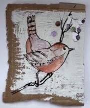 Bird balancing between berries.